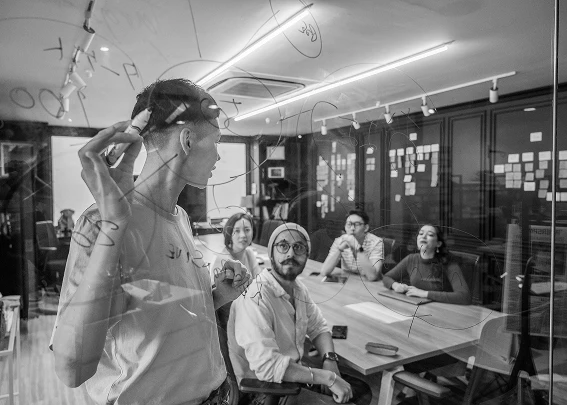 Collaborative Work Session in Black and White
